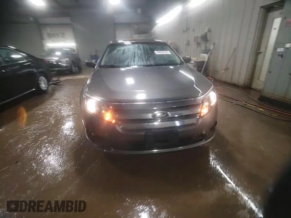 2012 Ford Fusion SE z VIN 3FAHP0HG5CR392483, wystawiony jako Copart lot #48069745 z przebiegiem 155 171 mil mil oraz Szkoda całkowita • Salvage title. Historia ofert i sprzedaży dostępna na DreamBid. Obrazek 13.
