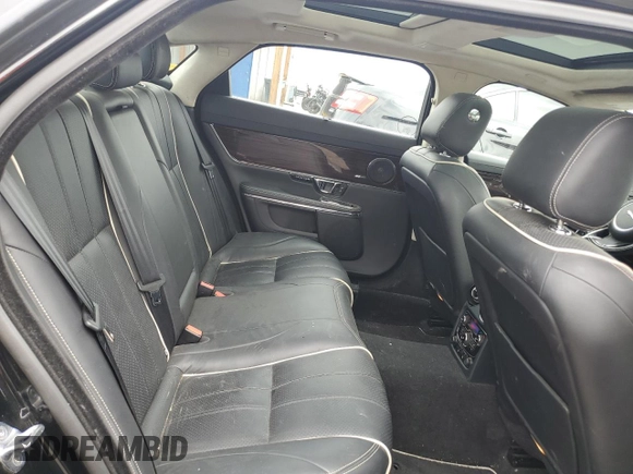 2014 Jaguar XJ Portfolio with VIN SAJWJ2GD4E8V69651, listed as a Copart auction lot 52426195 with 56,413 mi miles and Salvage title. Bid and sale history available at DreamBid. Image 10.