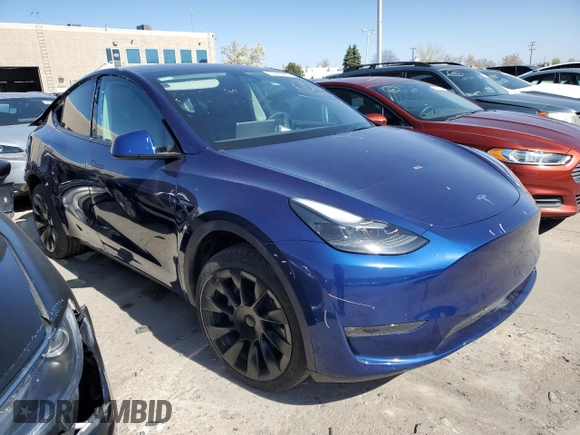 2023 Tesla Model Y Long Range with VIN 7SAYGAEE6PF689615, listed as a Copart auction lot 50999385 with 16,514 mi miles and Salvage Title. Bid and sale history available at DreamBid. Image 4.