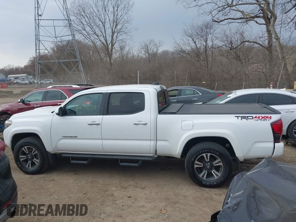2018 Toyota Tacoma SR5 with VIN 3TMDZ5BN9JM051105, listed as a IAAI auction lot 41708034 with 98,000 mi miles and . Bid and sale history available at DreamBid. Image 14.