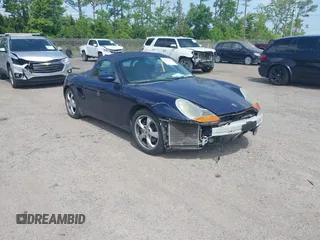 2002 Porsche Boxster z VIN WP0CA29812U622973, wystawiony jako IAAI lot #42104707 z przebiegiem 56 744 mil mil oraz . Historia ofert i sprzedaży dostępna na DreamBid. Obrazek 1.