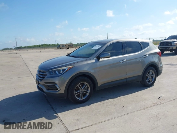 2017 Hyundai Santa Fe 2.4L z VIN 5XYZTDLB7HG444033, wystawiony jako IAAI lot #42263907 z przebiegiem 107 454 mil mil oraz . Historia ofert i sprzedaży dostępna na DreamBid. Obrazek 2.