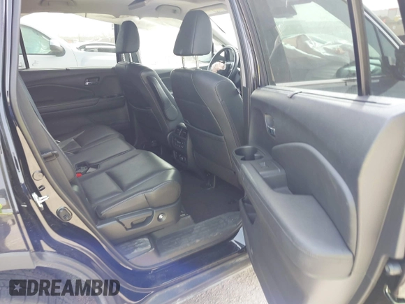 2020 Honda Pilot Touring 8-Passenger with VIN 5FNYF6H91LB003552, listed as a IAAI auction lot 41743685 with 76,725 mi miles and . Bid and sale history available at DreamBid. Image 8.