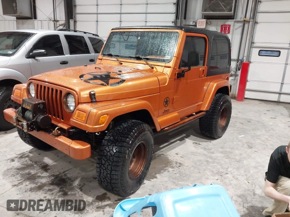 1998 Jeep Wrangler Sahara z VIN 1J4FY49S1WP802940, wystawiony jako IAAI lot #41433820 z przebiegiem 122 180 mil mil oraz . Historia ofert i sprzedaży dostępna na DreamBid. Obrazek 2.
