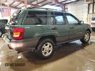 2000 Jeep Grand Cherokee Laredo with VIN 1J4GW48S2YC256123, listed as a Copart auction lot 56015855 with 147,549 mi miles and Salvage title. Bid and sale history available at DreamBid. Image 3.