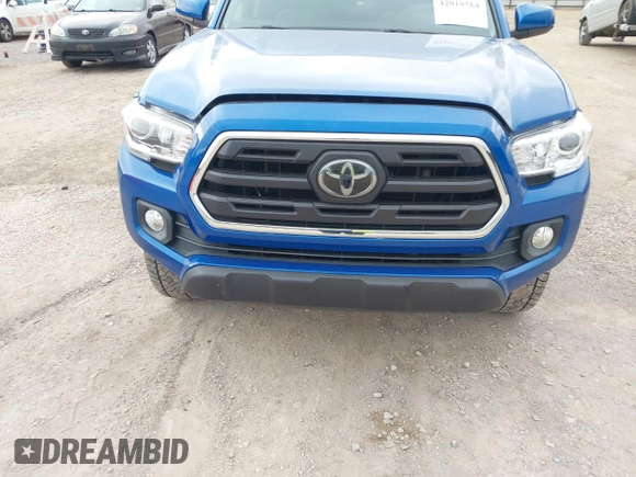 2018 Toyota Tacoma SR5 with VIN 3TMAZ5CNXJM069212, listed as a IAAI auction lot 42010564 with 73,825 mi miles and . Bid and sale history available at DreamBid. Image 6.