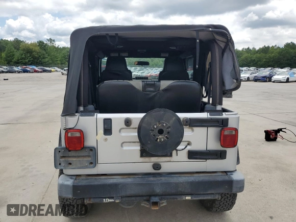 2005 Jeep Wrangler X with VIN 1J4FA39S55P353789, listed as a Copart auction lot 62469015 with 143,817 mi miles and Salvage title. Bid and sale history available at DreamBid. Image 6.