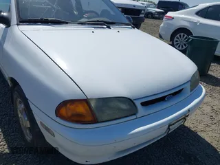 1995 Ford Aspire with VIN KNJLT05H4S6151892, listed as a IAAI auction lot 42023883 with 221,899 mi miles and . Bid and sale history available at DreamBid. Image 6.