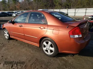 2009 Kia Spectra SX with VIN KNAFE221X95026213, listed as a Copart auction lot 85348104 with 124,171 mi miles and Salvage Title. Bid and sale history available at carsss.com. Image 2.