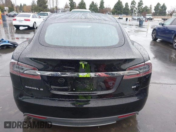 2013 Tesla Model S with VIN 5YJSA1CN0DFP20053, listed as a IAAI auction lot 41470660 with 61,568 mi miles and . Bid and sale history available at DreamBid. Image 17.