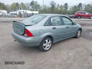2004 Ford Focus ZTS with VIN 1FAFP38Z74W117402, listed as a IAAI auction lot 42035928 with 113,393 mi miles and . Bid and sale history available at carsss.com. Image 4.