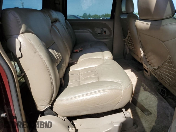 1998 GMC Suburban z VIN 3GKFK16R1WG503206, wystawiony jako Copart lot #69802344 z przebiegiem 231 148 mil mil oraz Szkody całkowita. Historia ofert i sprzedaży dostępna na DreamBid. Obrazek 12.