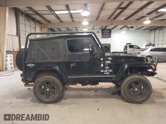 1999 Jeep Wrangler Sahara z VIN 1J4FY49S4XP432567, wystawiony jako IAAI lot #41562455 z przebiegiem Nie podano mil oraz . Historia ofert i sprzedaży dostępna na DreamBid. Obrazek 13.
