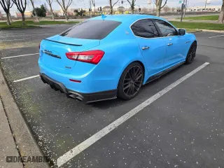 2014 Maserati Ghibli S Q4 with VIN ZAM57RTA7E1089301, listed as a Copart auction lot 54070585 with 59,787 mi miles and Salvage Title. Bid and sale history available at carsss.com. Image 4.