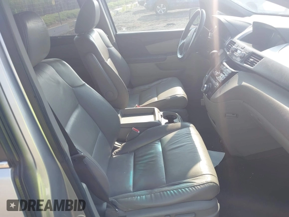 2012 Honda Odyssey EX-L with VIN 5FNRL5H65CB039015, listed as a IAAI auction lot 42612886 with 216,955 mi miles and . Bid and sale history available at DreamBid. Image 5.