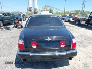 1999 Bentley Arnage z VIN SCBLB51E1XCX01401, wystawiony jako IAAI lot #42133144 z przebiegiem 29 699 mil mil oraz . Historia ofert i sprzedaży dostępna na DreamBid. Obrazek 16.