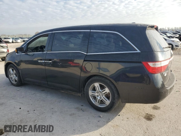 2012 Honda Odyssey Touring with VIN 5FNRL5H9XCB022284, listed as a Copart auction lot 82766824 with Not provided miles and Salvage title. Bid and sale history available at DreamBid. Image 2.