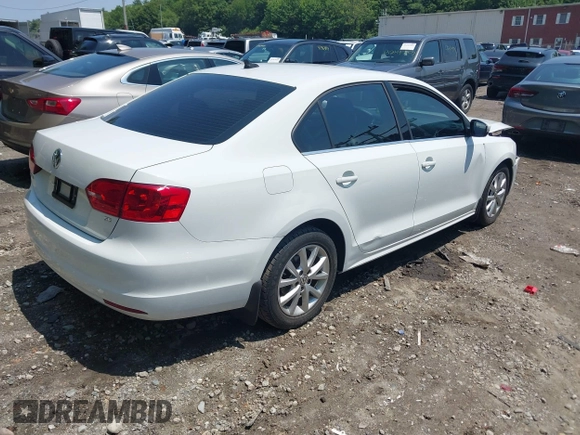 2014 Volkswagen Jetta SE with VIN 3VWD17AJ5EM437072, listed as a IAAI auction lot 42463048 with 99,030 mi miles and . Bid and sale history available at DreamBid. Image 4.