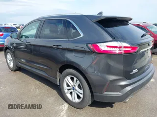 2020 Ford Edge SEL z VIN 2FMPK3J9XLBA54556, wystawiony jako IAAI lot #42179907 z przebiegiem 63 449 mil mil oraz . Historia ofert i sprzedaży dostępna na DreamBid. Obrazek 3.