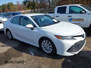 2020 Toyota Camry LE with VIN 4T1C11AKXLU986310, listed as a IAAI auction lot 40977100 with 108,208 mi miles and . Bid and sale history available at DreamBid. Image 1.