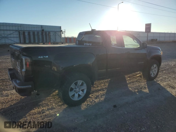 2015 GMC Canyon 4WD SLE with VIN 1GTH6BE37F1133213, listed as a Copart auction lot 82404014 with 142,149 mi miles and Salvage Title. Bid and sale history available at carsss.com. Image 3.