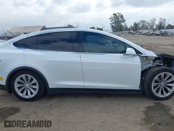 2020 Tesla Model X Long Range with VIN 5YJXCDE26LF238982, listed as a IAAI auction lot 42100220 with 44,804 mi miles. Bid and sale history available at carsss.com. Image 14.