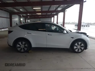 2023 Tesla Model Y Long Range z VIN 7SAYGDEE2PF834036, wystawiony jako IAAI lot #41933120 z przebiegiem 27 872 mil mil oraz . Historia ofert i sprzedaży dostępna na DreamBid. Obrazek 14.