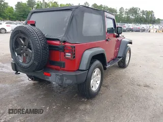 2012 Jeep Wrangler Sport with VIN 1C4AJWAG3CL197295, listed as a IAAI auction lot 42349118 with 117,381 mi miles and . Bid and sale history available at DreamBid. Image 4.