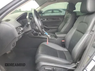 2024 Honda Civic Touring z VIN 2HGFE1F96RH324748, wystawiony jako Copart lot #58833725 z przebiegiem Nie podano mil oraz Szkoda całkowita • Salvage title. Historia ofert i sprzedaży dostępna na DreamBid. Obrazek 7.