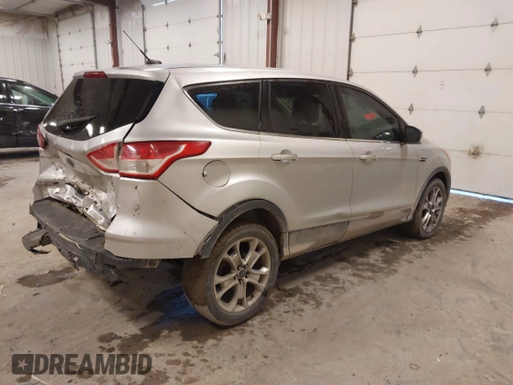 2013 Ford Escape SEL with VIN 1FMCU0H98DUC72150, listed as a IAAI auction lot 41213748 with 136,323 mi miles. Bid and sale history available at carsss.com. Image 4.