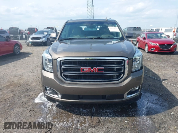 2016 GMC Yukon SLT with VIN 1GKS1BKC9GR328861, listed as a IAAI auction lot 42010839 with 200,711 mi miles. Bid and sale history available at carsss.com. Image 12.