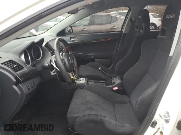 2010 Mitsubishi Lancer Evolution SE with VIN JA32W6FV3AU034052, listed as a Copart auction lot 72463644 with 44,517 mi miles and Salvage Title. Bid and sale history available at carsss.com. Image 7.