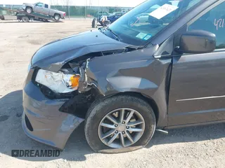 2015 Dodge Grand Caravan SE with VIN 2C4RDGBG2FR684367, listed as a IAAI auction lot 42167621 with 216,628 mi miles and . Bid and sale history available at DreamBid. Image 6.