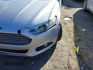 2016 Ford Fusion Titanium Hybrid with VIN 3FA6P0RU7GR364573, listed as a IAAI auction lot 41298298 with 189,900 mi miles. Bid and sale history available at carsss.com. Image 6.