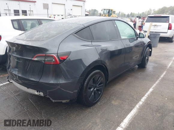 2025 Tesla Model Y Long Range with VIN 7SAYGDED8SA340082, listed as a IAAI auction lot 41915369 with 7,296 mi miles and . Bid and sale history available at DreamBid. Image 4.