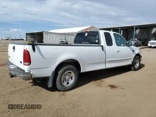 1999 Ford F-150 with VIN 2FTRX17L0XCA37979, listed as a Copart auction lot 58216695 with 256,055 mi miles and Clean title. Bid and sale history available at DreamBid. Image 3.