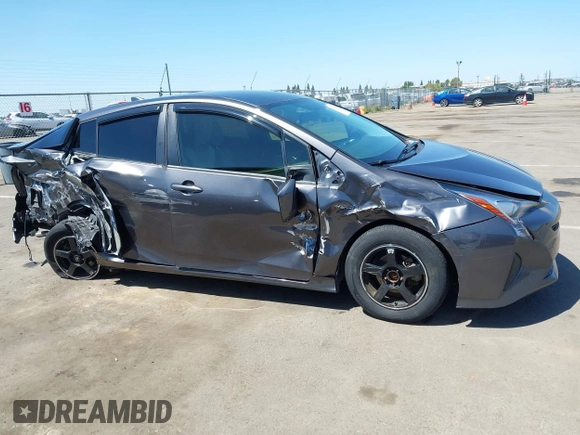 2016 Toyota Prius Two z VIN JTDKBRFU1G3521884, wystawiony jako IAAI lot #42081852 z przebiegiem 93 107 mil mil oraz . Historia ofert i sprzedaży dostępna na DreamBid. Obrazek 13.