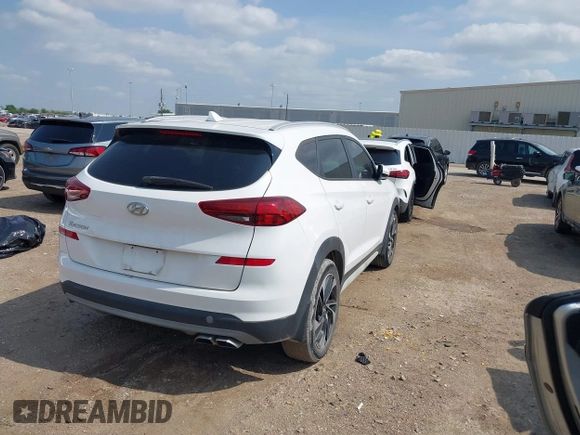 2019 Hyundai Tucson Sport with VIN KM8J33AL1KU861698, listed as a IAAI auction lot 42129173 with 100,160 mi miles. Bid and sale history available at carsss.com. Image 4.