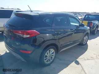 2017 Hyundai Tucson Value with VIN KM8J33A28HU302472, listed as a IAAI auction lot 41717598 with 126,438 mi miles. Bid and sale history available at carsss.com. Image 4.