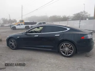 2015 Tesla Model S 85D with VIN 5YJSA1E24FF111120, listed as a IAAI auction lot 41471698 with 58,126 mi miles. Bid and sale history available at carsss.com. Image 15.