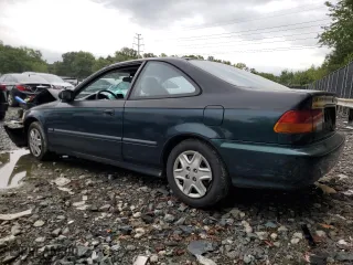 1997 Honda Civic DX with VIN 1HGEJ6223VL057580, listed as a Copart auction lot 74752434 with 239,657 mi miles and Salvage Title. Bid and sale history available at carsss.com. Image 2.