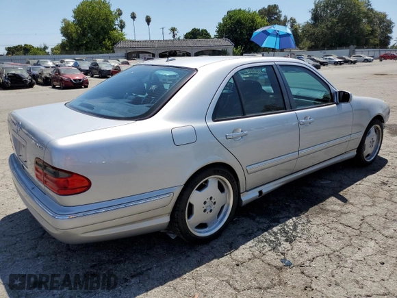 2000 Mercedes-Benz E with VIN WDBJF74J7YB055624, listed as a Copart auction lot 63880184 with 71,355 mi miles and Salvage Title. Bid and sale history available at DreamBid. Image 3.