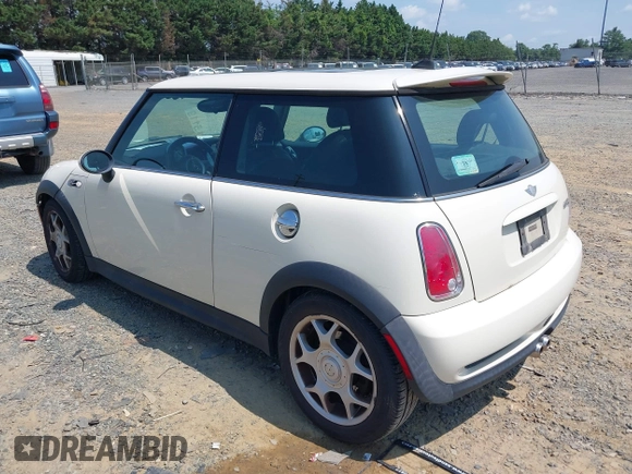 2006 MINI Hardtop S with VIN WMWRE33596TJ37959, listed as a IAAI auction lot 42635457 with 124,440 mi miles and . Bid and sale history available at DreamBid. Image 3.