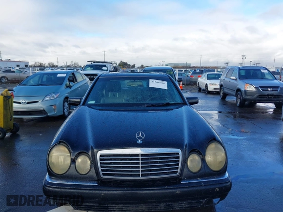 1997 Mercedes-Benz E-Class with VIN WDBJF72F1VA281514, listed as a IAAI auction lot 41586496 with 283,212 mi miles. Bid and sale history available at carsss.com. Image 6.