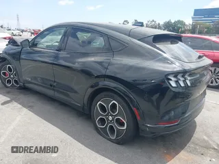 2023 Ford Mustang Mach-E GT z VIN 3FMTK4SE1PMA44650, wystawiony jako IAAI lot #42127300 z przebiegiem 7121 mil mil oraz . Historia ofert i sprzedaży dostępna na DreamBid. Obrazek 3.