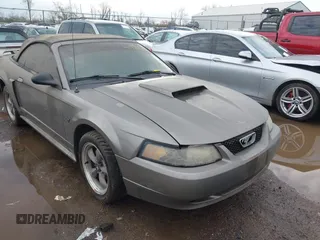 2002 Ford Mustang GT Deluxe z VIN 1FAFP45X32F169177, wystawiony jako IAAI lot #41880690 z przebiegiem 107 284 mil mil oraz . Historia ofert i sprzedaży dostępna na DreamBid. Obrazek 1.