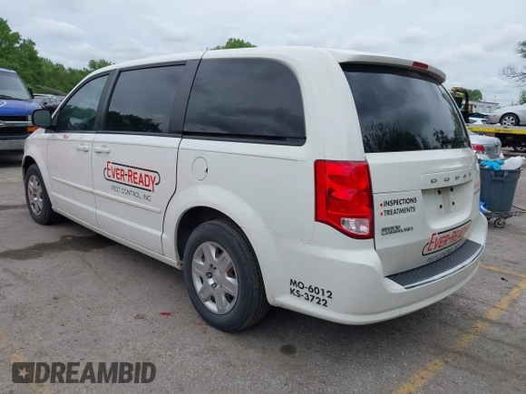 2013 Dodge Grand Caravan SE with VIN 2C4RDGBG8DR505844, listed as a IAAI auction lot 42139152 with 206,399 mi miles and . Bid and sale history available at DreamBid. Image 3.