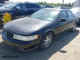 1998 Cadillac Seville Touring STS with VIN 1G6KY5499WU916185, listed as a IAAI auction lot 42035783 with 164,763 mi miles. Bid and sale history available at carsss.com. Image 2.