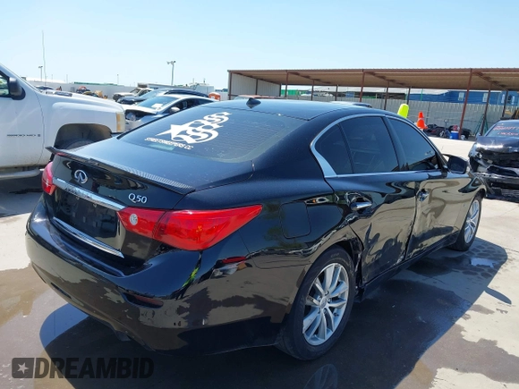 2015 Infiniti Q50 Premium with VIN JN1BV7AP9FM355526, listed as a IAAI auction lot 42010401 with 67,131 mi miles. Bid and sale history available at carsss.com. Image 4.