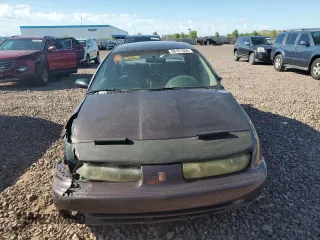 1999 Saturn SL with VIN 1G8ZK527XXZ136922, listed as a Copart auction lot 86704404 with 134,897 mi miles and Salvage Title. Bid and sale history available at carsss.com. Image 5.